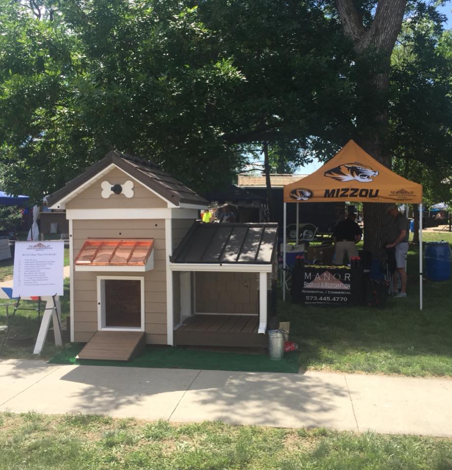 Dog house showcasing roofing and siding materials and choices outside