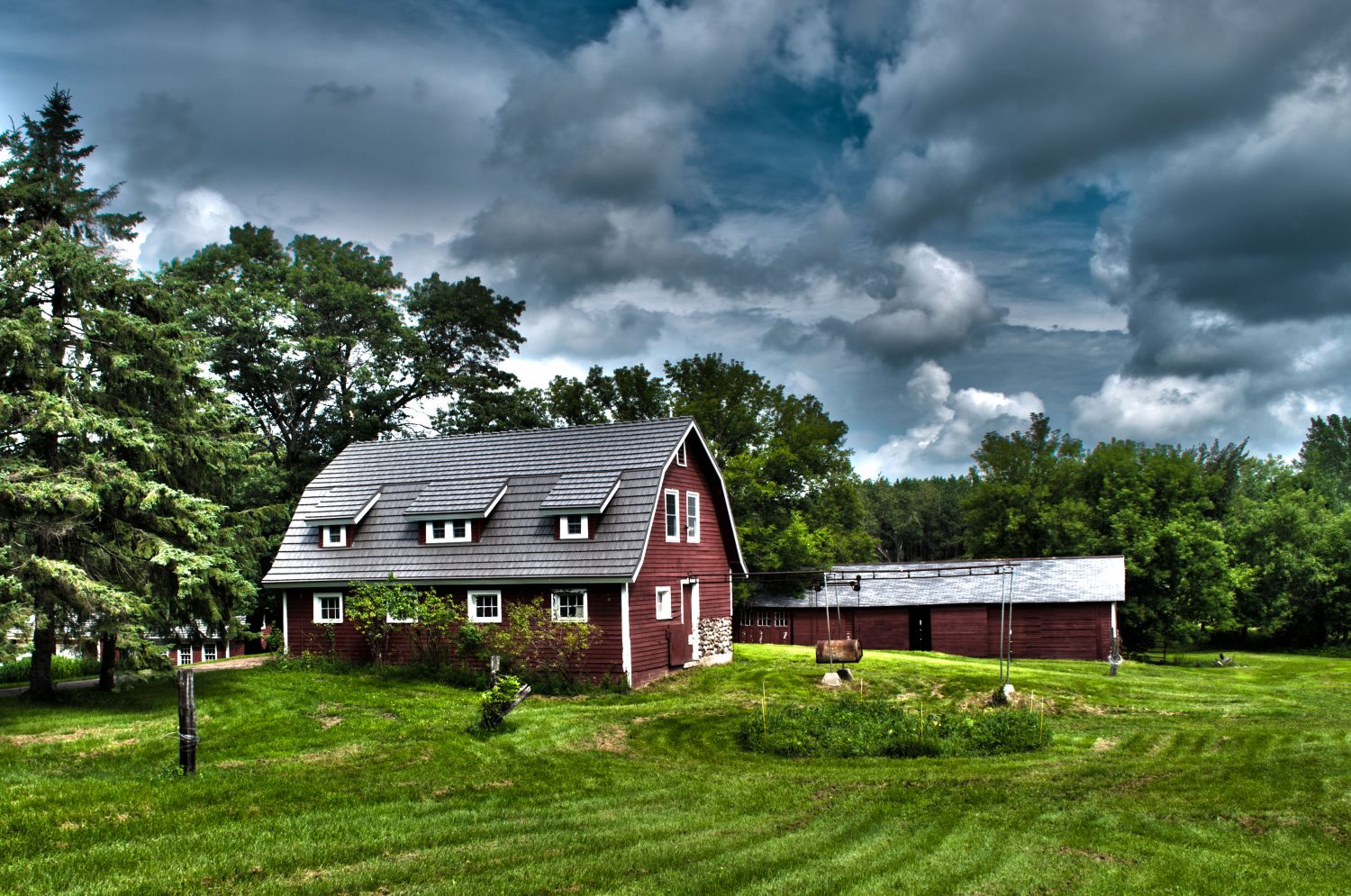 large farm house, red barn with wooden shingle roof